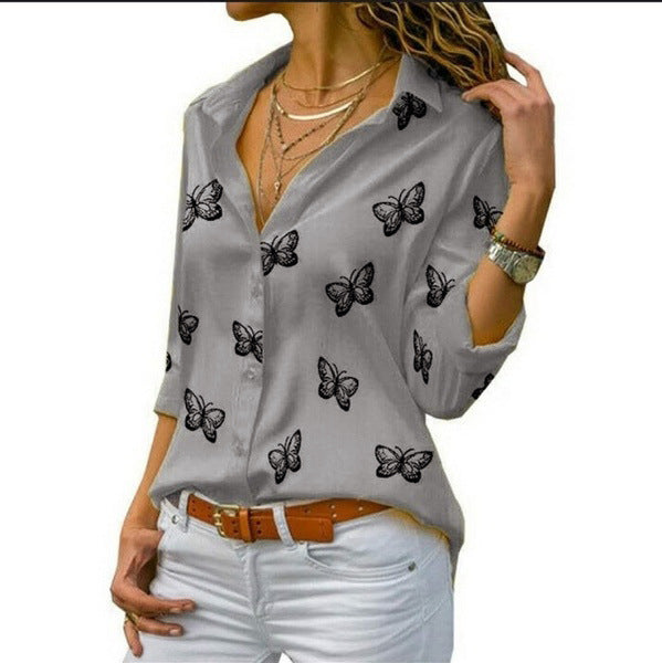 Neleia – Blusa caída con estampado de mariposas