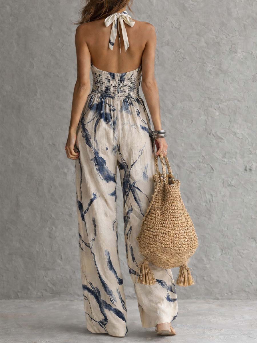 Mono con estampado de tinta en color marino y cuello halter, con pantalones anchos y bolsillos