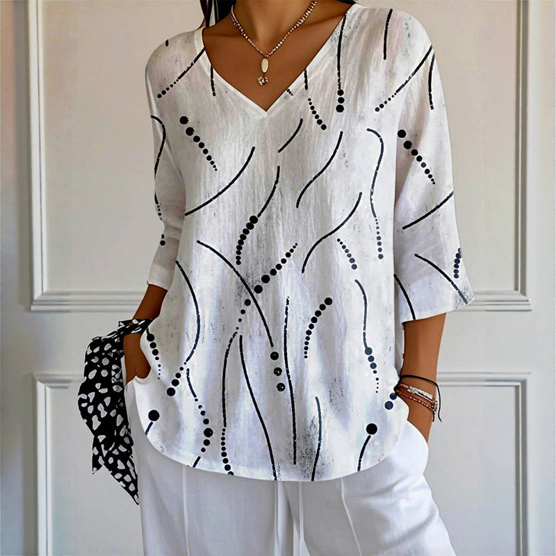 Esmee – Blusa con un juego de líneas juguetón y un corte ligero